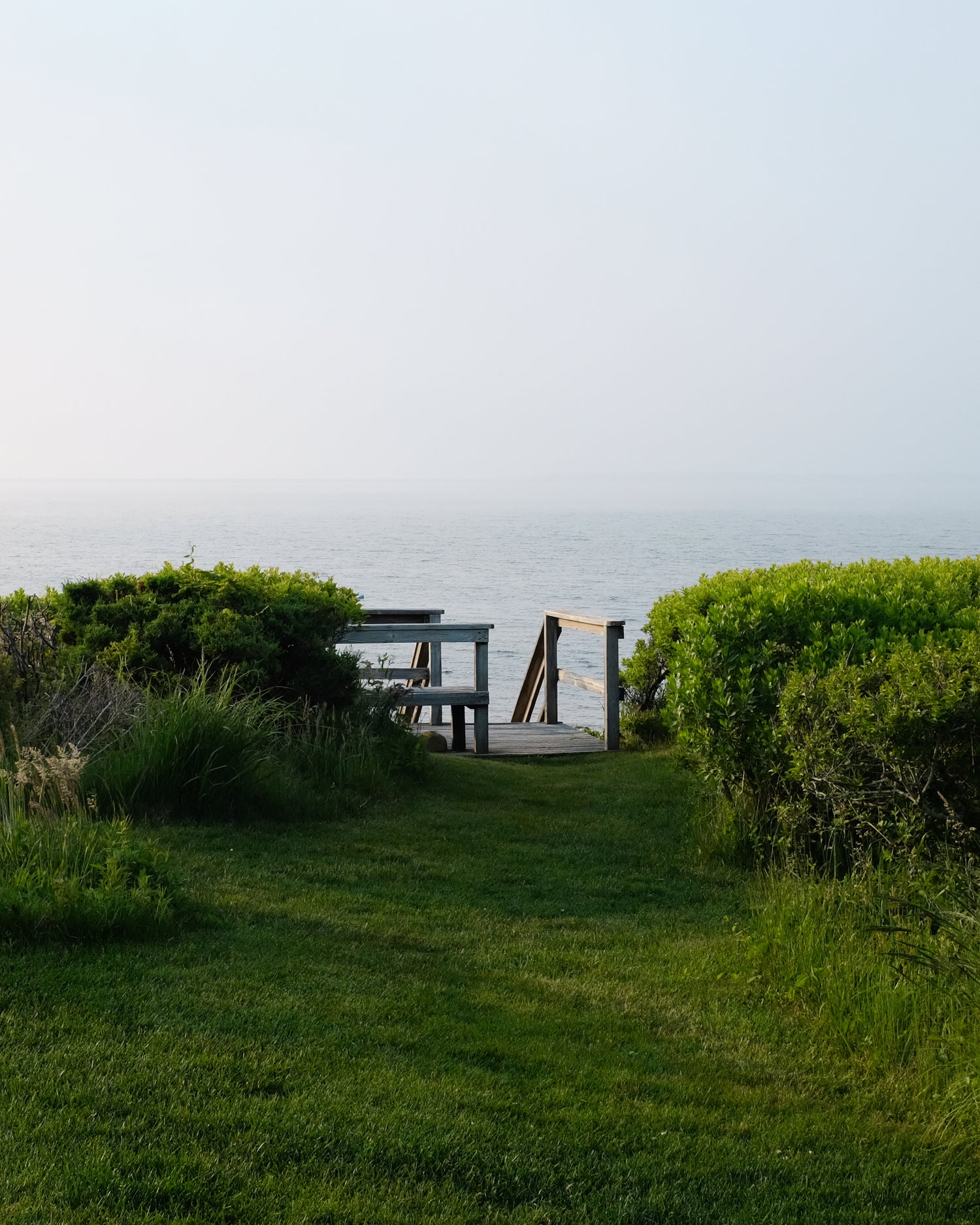 Picture of the Nantucket harbor and a staircase leading down to the beach.