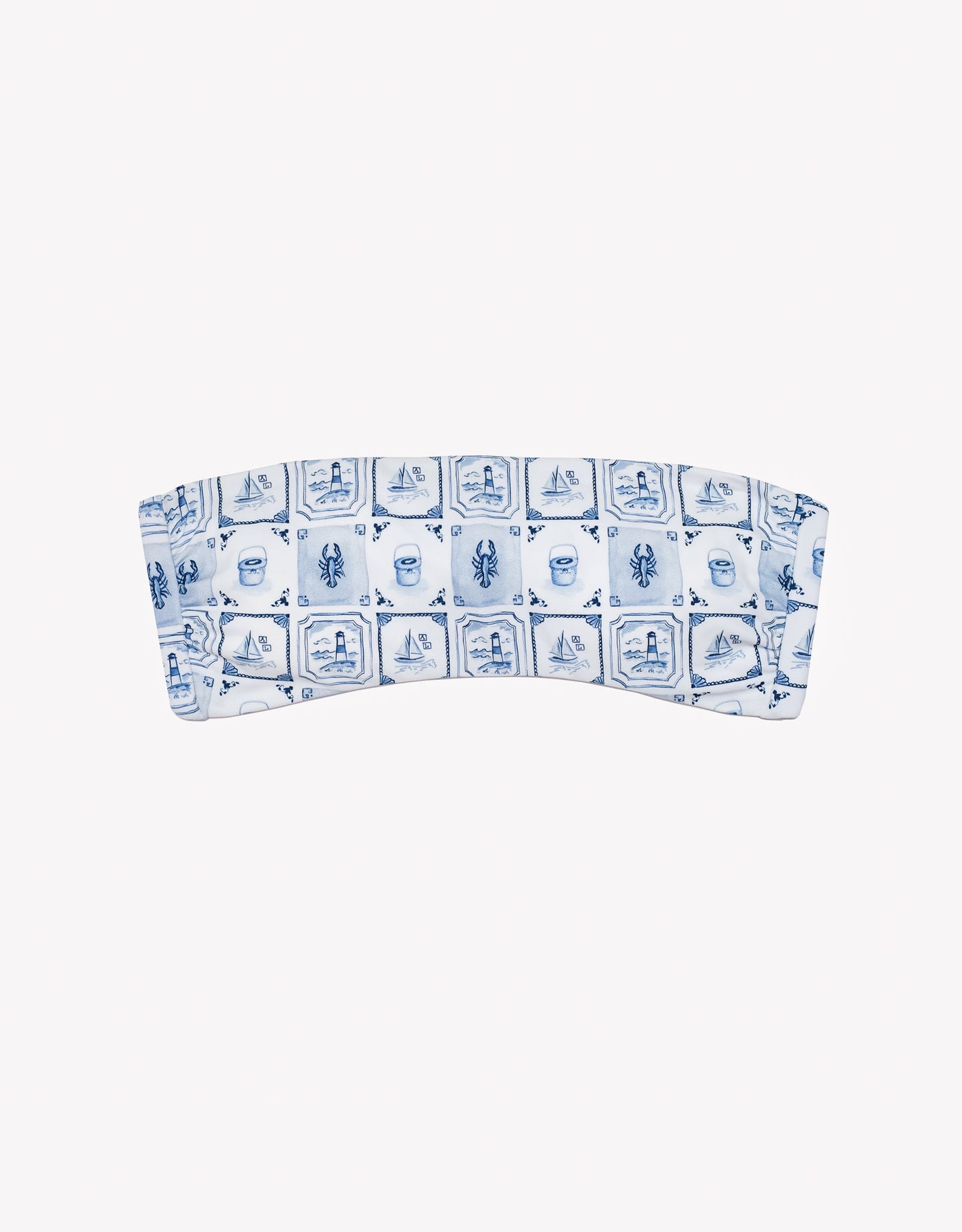 Bandeau top with blue and white pattern on a white background.