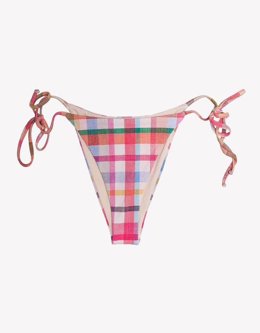 Multicolored plaid bikini bottom with tie sides on a white background.